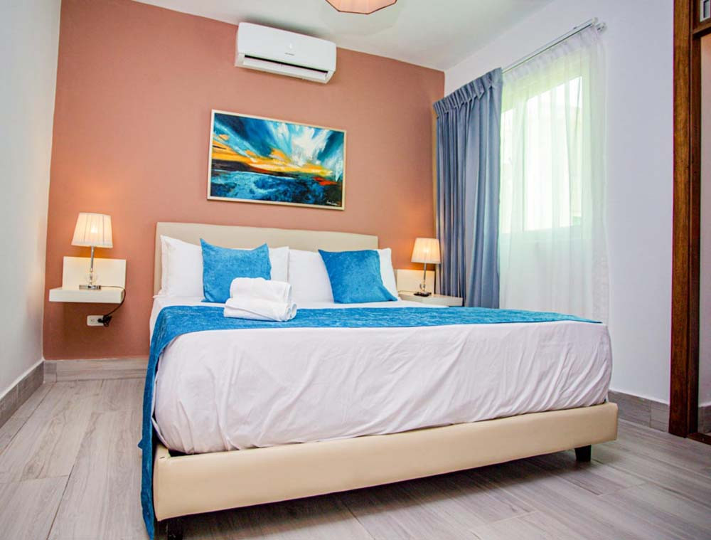 A view of a bedroom in the Beach Apartamentos at Playa Palmera Beach Resort